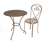 Table ronde en fer en packshot avec fauteuil coeur en fer